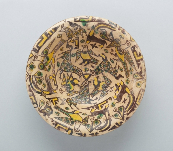 Bowl with Birds, Ibex, Floral, Calligraphic and Geometric Motifs, Nishapur, Iran, 9th-10th century, Abbasid Period (750-1258), Buff clay body with dark brown slip and yellow, green and clear glazes, Purchase 1970 John O’Neill Fund, Collection of the Newark Museum 70.16