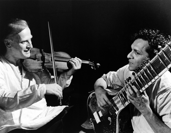 One of Shankar&apos;s first engagements with Western music was his collaboration with violinist Yehudi Menuhin (L). The two are shown here rehearsing together in 1966. (David Farrell/Redferns)