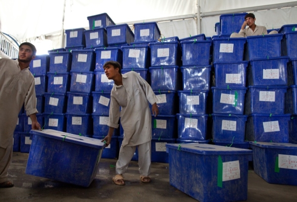 Workers carry ballot boxes at a warehouse of the Independent Election Commission center (IEC) on August 24, 2009 in Kabul.  (Paula Bronstein/Getty Images)