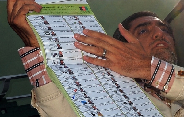 Presidential candidate Abdullah Abdullah shows evidence of alleged voting fraud at a press conference in Kabul on August 25, 2009. (Manan Vatsyayana/AFP/Getty Images)