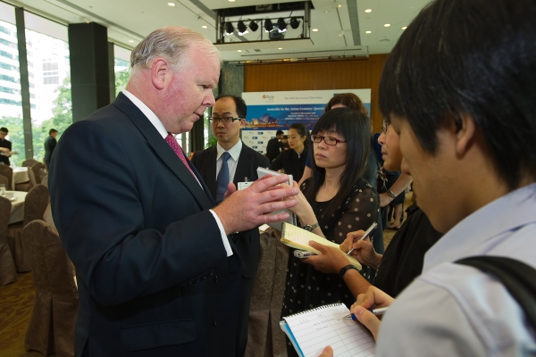 Michael Smith took time to respond to reporters' questions after the discussion. (Asia Society Hong Kong Center) 