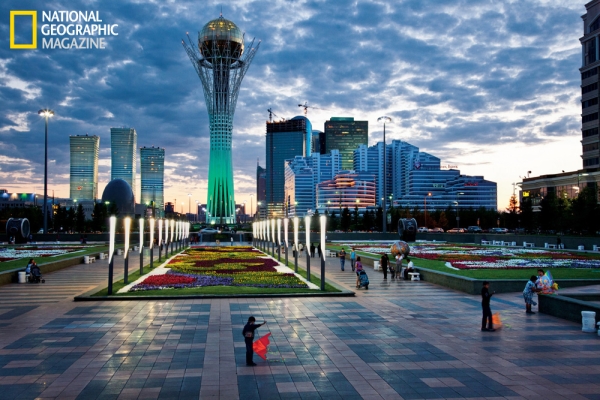 The Baiterek, towering over Astana's central promenade, flares green against the evening sky. The 318-foot monument evokes a giant tree with a golden egg in its branches. In the Kazakh myth of Samruk, a sacred bird lays a golden egg in the branches of a poplar tree each year. (©Gerd Ludwig/National Geographic)