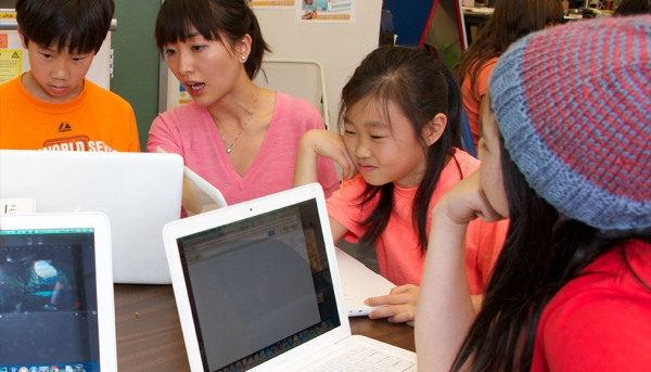 Chinese Ed Tech Coordinator Xiaoqing Chen with students (Chinese American International School)