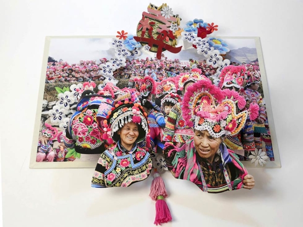 This spread, from Colette Fu's latest pop-up book, depicts the legend underlying a Yi village's custom of wearing cockscomb hats that bring luck, safety and happiness to its people. (Colette Fu)