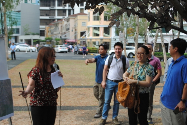 Participants listen to a presentation on the Fort Bonifacio water tank (Emily Peckenham/Asia Society)