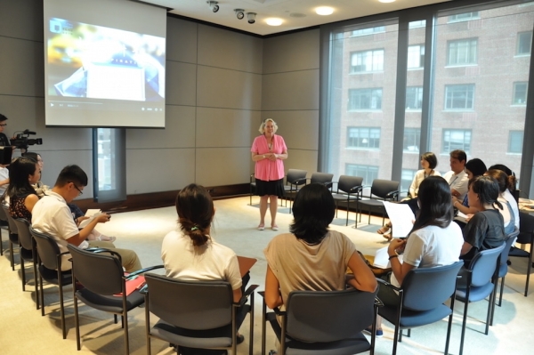 Asia Society Volunteer and Recruitment Manager Jacqueline Meyer (center) leads the orientation for the Young Scholars on their first day at Asia Society in New York. (Zhangbolong Liu & Zhu Xi/Asia Society)