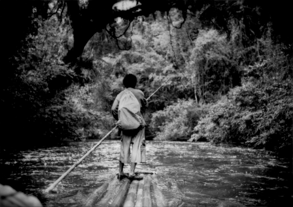 When fishing, Sam navigates his bamboo raft down the Sungai (River) Pertang to avoid a long walk back to his settlement. (James Whitlow Delano) 