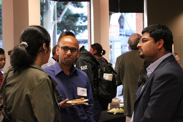 Audience members speak with Bandivadekar (far right) after the event. (Asia Society)