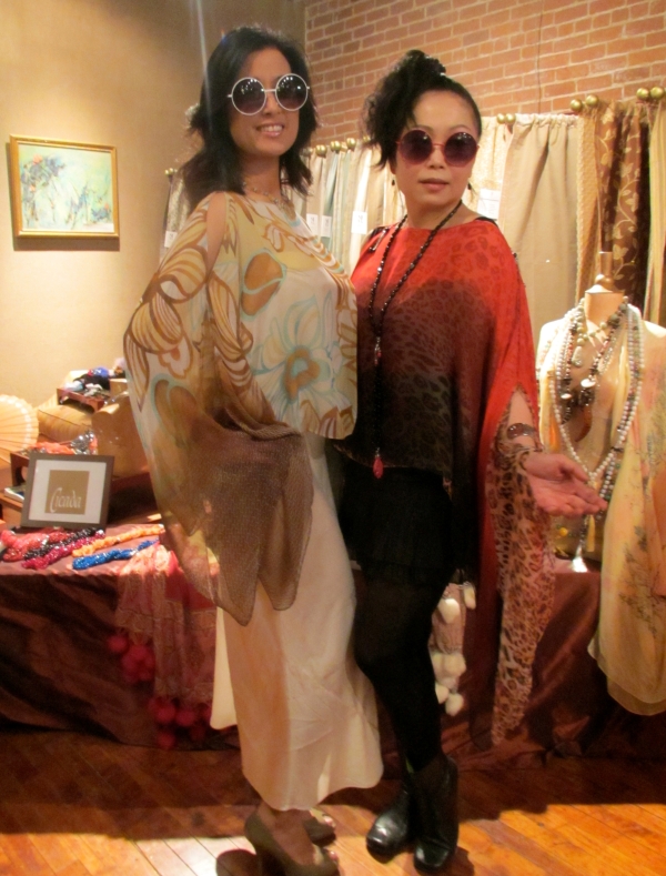 Designer Monique Zhang (r), of Cicada, poses with a shopper