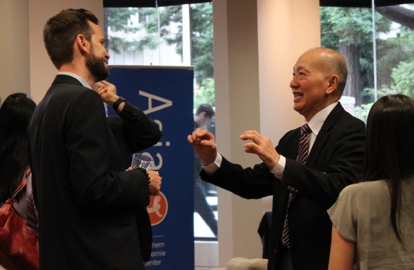 Winston Gilcrease, Program Manager at the China-US Energy Efficiency Alliance and Stanley Kwong, Professor at the University of San Francisco, share a chuckle. (Asia Society) 