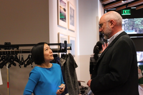 ASNC Senior Program Manager - Sustainability speaks with an attendee before the event. (Asia Society)