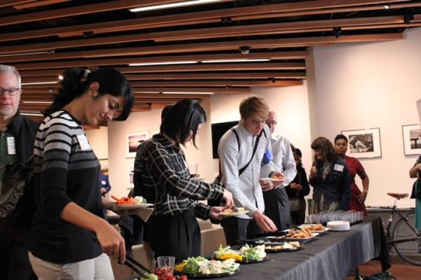 Attendees help themselves to some light snacks after the panel discussion. (Asia Society)