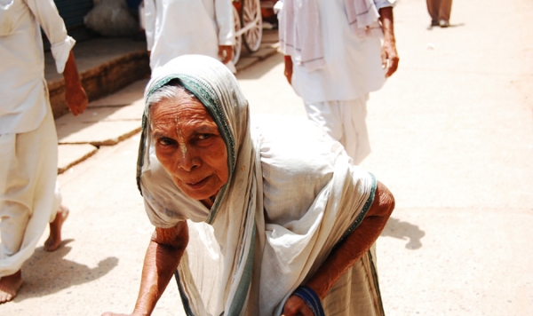 In Varanasi, India, Hinduism's holiest city, a widow begs on the streets in a white sari. According to tradition she must remain here until her death. (Shreeya Sinha) 