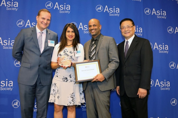 Apoorva Gandhi (L3) on behalf of Marriott receives the award for Distinguished Performance: Best Employer for Promoting Asian Pacific American Women. (Ellen Wallop/Asia Society)