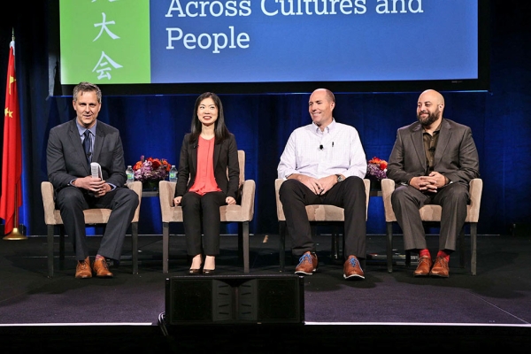 (L to R) Dan Washburn, Carrie Xu, Chad Lewis, and Rafael Stone speak in the second plenary session, "Sports as an Ambassador Across Cultures and People." (David Keith/David Keith Photography)