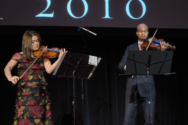 Guests were treated to a performance of Handel&apos;s &lt;i&gt;Passacaglia&lt;/i&gt; as well as a rendition of the Korean folk song &lt;i&gt;Arirang&lt;/i&gt; by assistant concertmaster Michelle Kim (L) and violist Vivek Kamath (R), both members of the Philharmonic. (Elsa Ruiz/Asia Society)