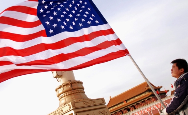 A worker hoists a US flag on Tiananmen Square, on the eve of President Obama&apos;s arrival in Beijing on November 16, 2009. (Wang Zhao/AFP/Getty Images)