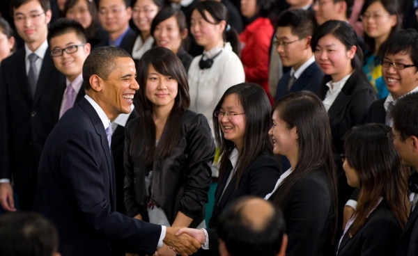 President Obama greets his audience following a town-hall meeting at the Museum of Science and Technology in Shanghai, on November 16, 2009.  Obama enjoys great popularity in China, especially among the youth. (Saul Loeb/AFP/Getty Images)