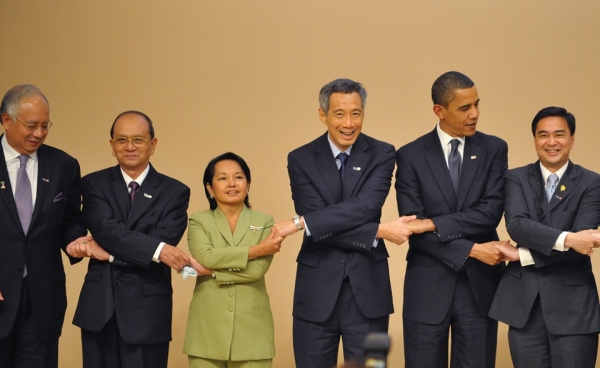 L to R: Malaysian Prime Minister Najib Razak, Myanmar Prime Minister General Thein Sein, Philippine President Gloria Macapagal Arroyo, Singapore Prime Minister Lee Hsien Loong, US President Barack Obama, and Thailand Prime Minister Abhisit Vejjajiva shake hands during the group photograph at the ASEAN-US leaders meeting in Singapore on November 15, 2009, on the sidelines of the Asia-Pacific Economic Cooperation (APEC) Summit. (Mandel Ngan/AFP/Getty Images)
