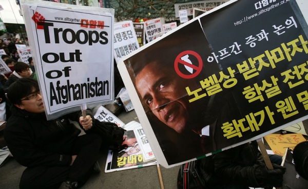 Protestors denounce the South Korean government&apos;s decision to send troops to Afghanistan in downtown Seoul, November 14, 2009, ahead of President Obama&apos;s visit to South Korea. (Chung Sung-Jun/Getty Images)