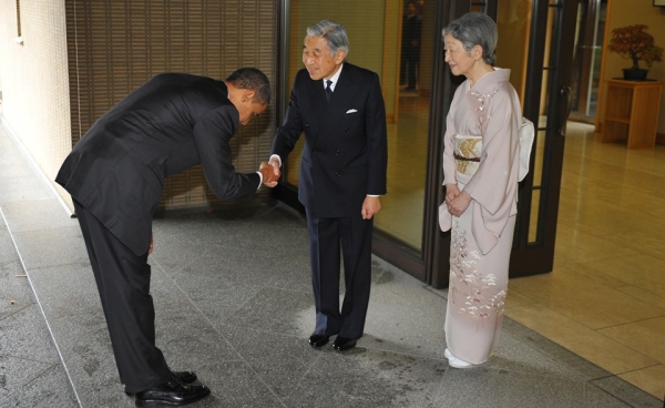 President Obama (L) bows as he shakes hands with Japanese Emperor Akihito (C) and as Empress Michiko (R) looks on, at the Imperial Palace in Tokyo on November 14, 2009. The bow has sparked controversy in the US where some argue that no sitting president should bow to another head of state. (Mandel Ngan/AFP/Getty Images)