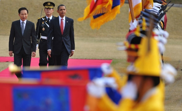 President Obama (R) and South Korean President Lee Myung-bak (L) walk together to inspect an honor guard during a welcome ceremony at the presidential Blue House in Seoul on November 19, 2009. Obama ends his maiden tour of Asia in Seoul with North Korea&apos;s nuclear programme and trade expected to be the main focus of a summit with Lee. (Mandel Ngan/AFP/Getty Images)