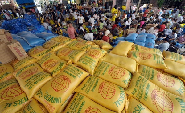 Volunteers pack relief goods at a school in Manila on September 30, 2009 for distribution to survivors of the deadly Philippine floods. Tropical storm Ketsana hit the country, pouring a month&apos;s worth of rain in just nine hours, causing over 240 deaths and displacing hundreds of thousands of people. (Jay Directo/AFP/Getty Images)