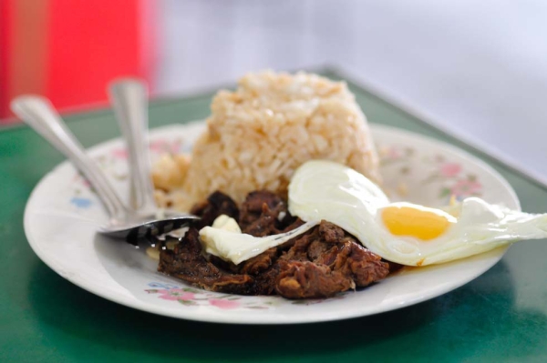 Tapsilog, a traditional Filipino meal primarily served during breakfast that consists of garlic-fried rice, tapa (dried beef), and fried egg. (Ryan Fernandez)
