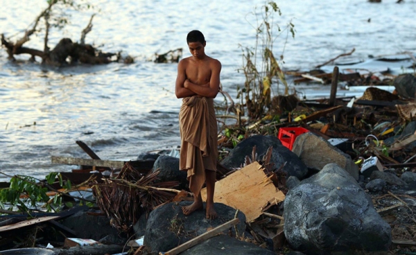 A man looks over the debris at the waterfront on Lalomanu, Samoa on September 30, 2009, a day after an earthquake struck 200km from Samoa&apos;s capital Apia, triggering a tsunami that has killed 148 people.  (Phil Walter/Getty Images)