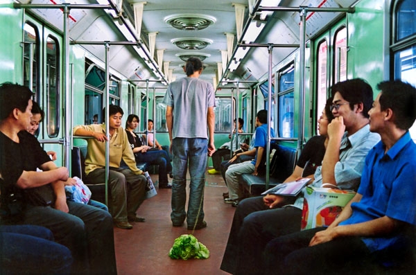 Walking the Cabbage in the Subway Beijing, PRC, 2004.
Courtesy of Han Bing. 
