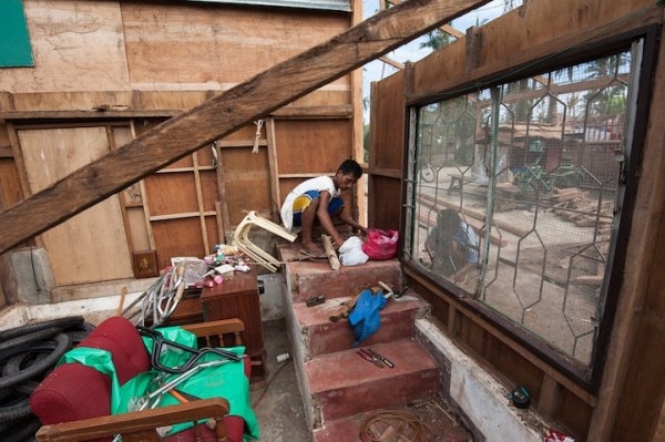 Two men start to rebuild their home in the aftermath of Typhoon Yolanda, Cebu.