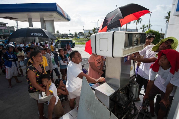 Residents line up for kerosene supply in Bogo, Cebu after Typhoon Yolanda passed through northern Cebu.
