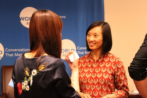 Liu talks to an audience member after the event. (Asia Society)
