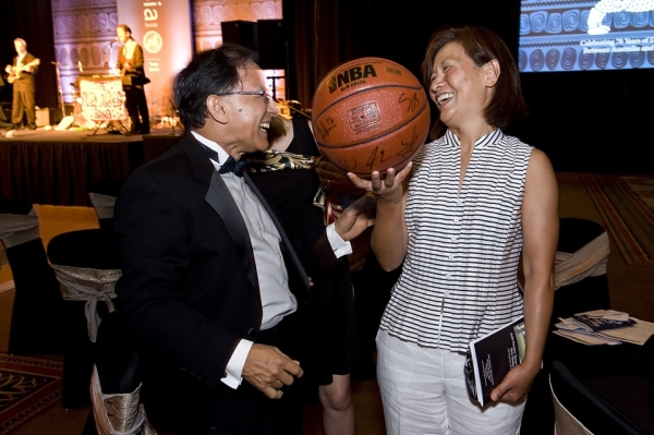 Two guests were more than happy to walk away with a basketball signed by Yao Ming at the evening&apos;s big board auction. (Jeff Fantich Photography)