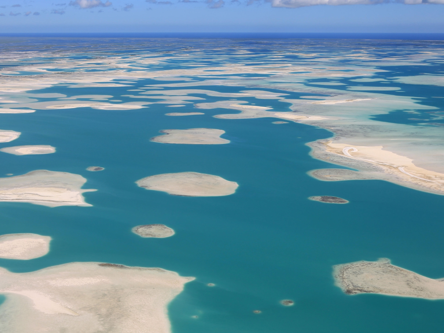 Aerial view of the lagoons of Kirimati, also known as Christmas Island, part of the Republic of Kiribati in the central Pacific Ocean.