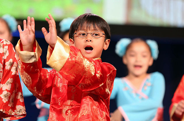 A Houston area student sings at the opening of the 2017 National Chinese Language Conference. (David Keith)