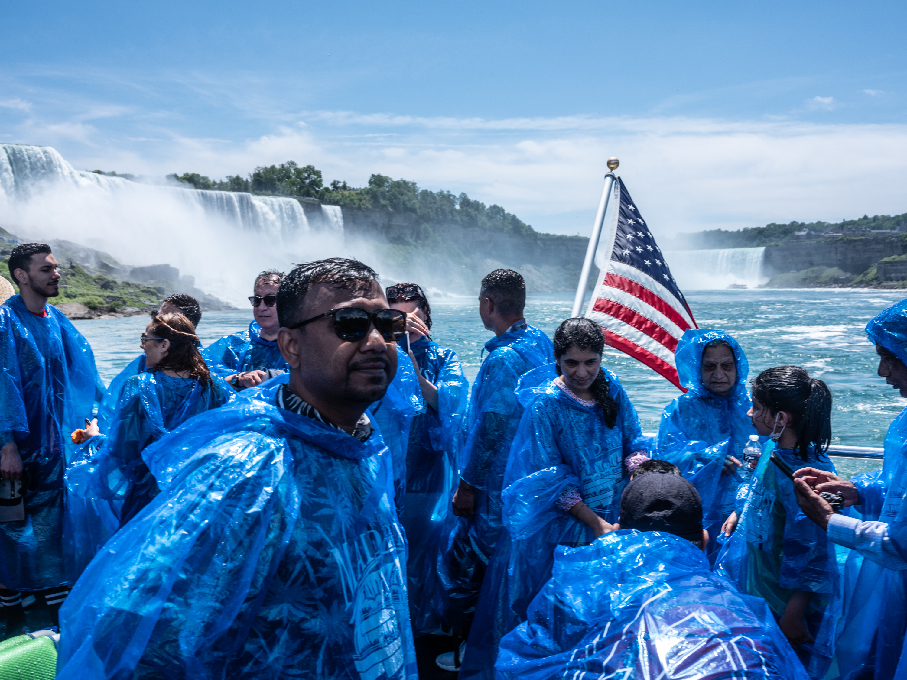 Mohammed enjoys the mist of Niagara Falls in July 2022. He and his wife Cherry, joined Nova, Shapla, and Mithu on a trip to the State Park. 