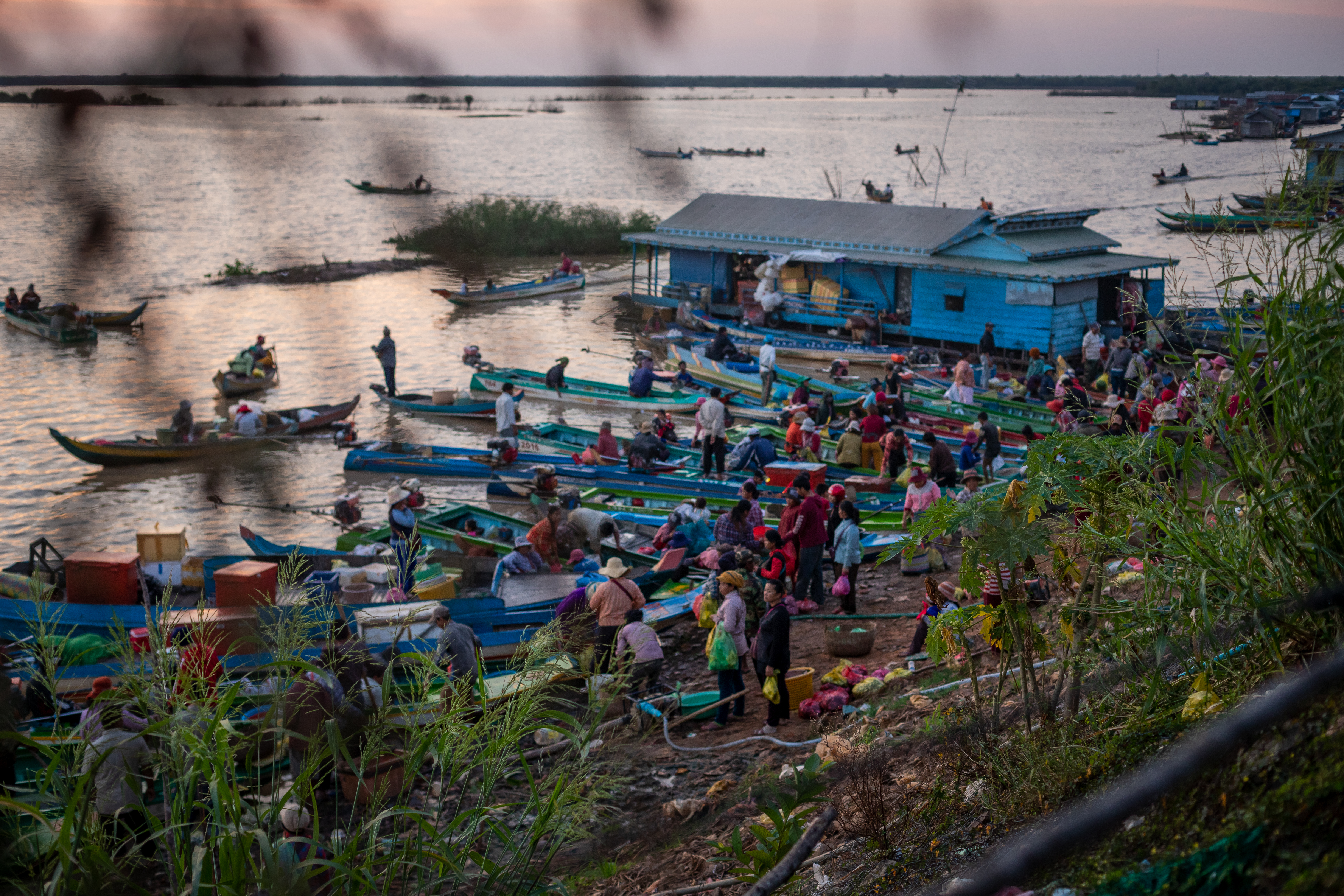 Vendors gather at the edge of the Tonle Sap lake in Siem Reap's Chong Kneas village in January 2017.