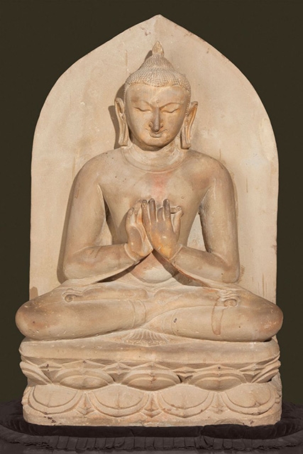 Buddha seated in dharmacakra mudra. Pagan period, 11th century. Sandstone. H. 42 x W. 27 x D. 10 in. (106.7 x 68.6 x 25.4 cm). Bagan Archaeological Museum. (Sean Dungan)