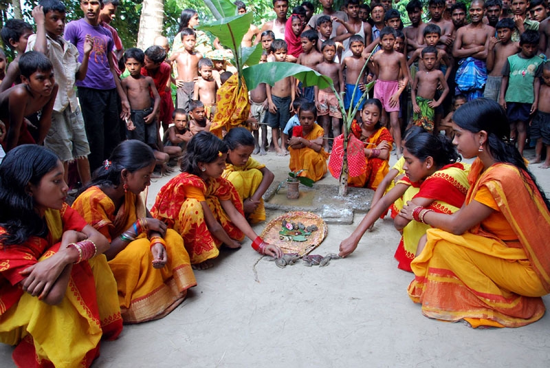 Bangladeshi villagers officiate a frog wedding in Sadullahpur district's Ramchandrapur village on August 10, 2010. (AFP/AFP/Getty Images) 