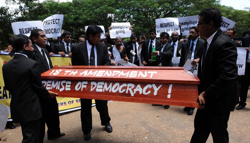Sri Lankan lawyers carry a makeshift coffin during a protest in Colombo on September 7, 2010 against a draft bill of the constitution that is being rushed through parliament on an urgent basis. (Ishara S. Kodikara/AFP/Getty Images)