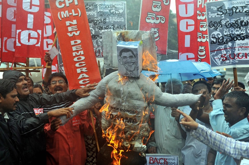 Many protested President Obama&apos;s visit to India. Activists of Communist Party of India (Marxist - Leninist) New Democracy burn an effigy against President Obama in Hyderabad on November 8, 2010. (Noah Seelam/AFP/Getty Images)
