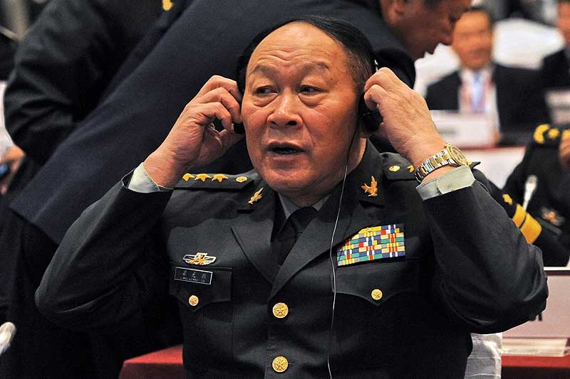 Getting an earful: Chinese Defense Minister Liang Guanglie puts on a headset to listen at the Asia-Pacific security forum in Singapore on June 4, 2011. (Roslan Rahman/AFP/Getty Images) 