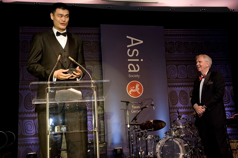 Yao Ming receives an award from Charles C. Foster, Chairman of the Asia Society Texas Center, at the Texas Center's annual Tiger Ball in Houston in 2010. (Jeff Fantich Photography)