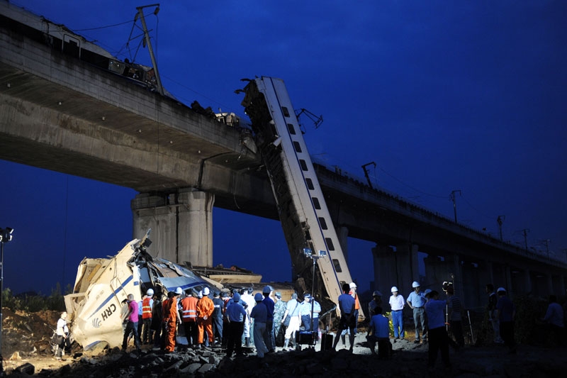 Workers clear wreckage on July 24, 2011 near the city of Wenzhou, in Zhejiang province, after a high-speed train collision a day before. The crash was China's worst rail accident since 2008. (STR/AFP/Getty Images)