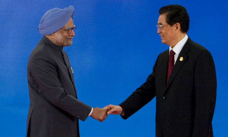 Indian Prime Minister Manmohan Singh (L) shakes hands with Chinese President Hu Jintao (R) during the opening of the BRICS summit meeting in Sanya, Hainan province, on April 14, 2011. (Nelson Ching/AFP/Getty Images)