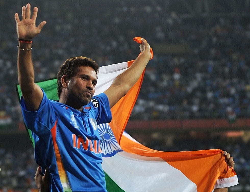 Tendulkar waves the tricolor while celebrating victory during the final of ICC Cricket world Cup 2011 match between India and Sri Lanka — Wankhede Stadium, Mumbai, on April 2, 2011. (Prakash Singh/AFP/Getty Images)