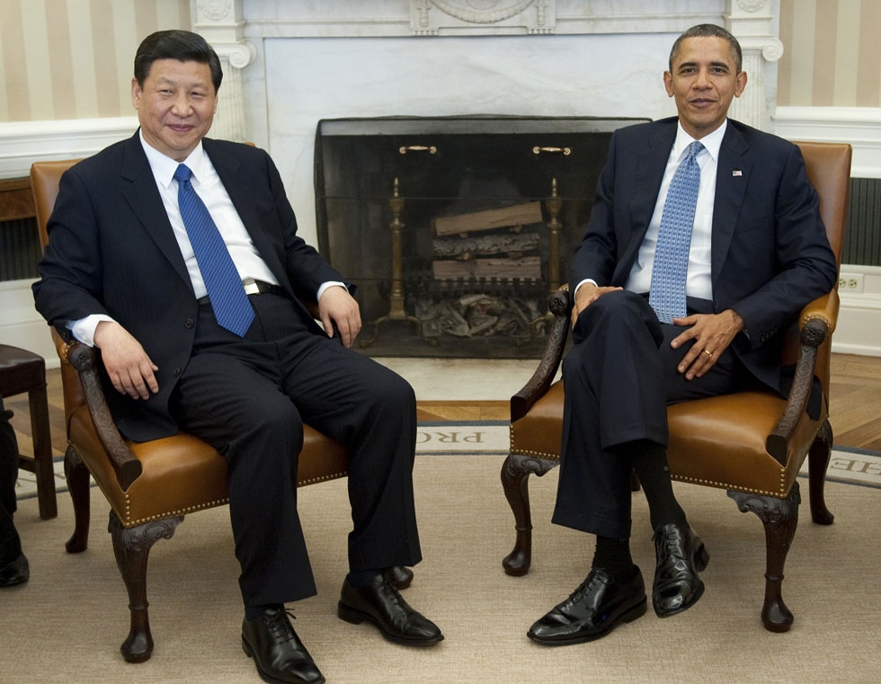 US President Barack Obama and Chinese Vice President Xi Jinping speak during meetings in the Oval Office of the White House in Washington, DC, February 14, 2012. (Saul Loeb/AFP/Getty Images)