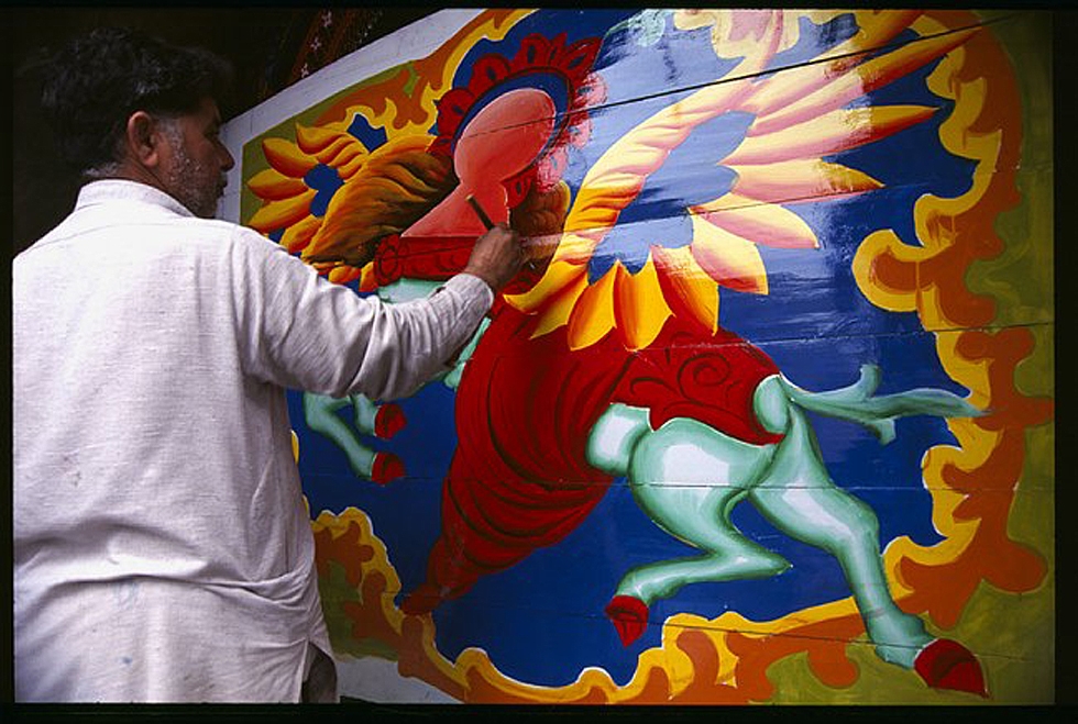 An artist painting Buraq, Prophet Mohammad's winged horse, on the side of a truck. (Peter Grant)
