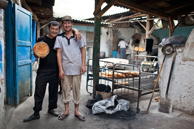 Two brothers in a family operation baking naan, a staple in the Kyrgyz diet. (Sue Anne Tay)